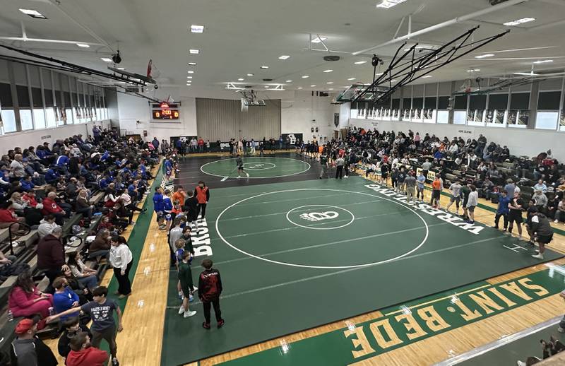 Wrestlers prepare to enter the finals during the Class 1A Regional meet on Saturday, Feb. 8, 2025 at St. Bede Academy. This is the first time the school has hosted a wrestling regional event.