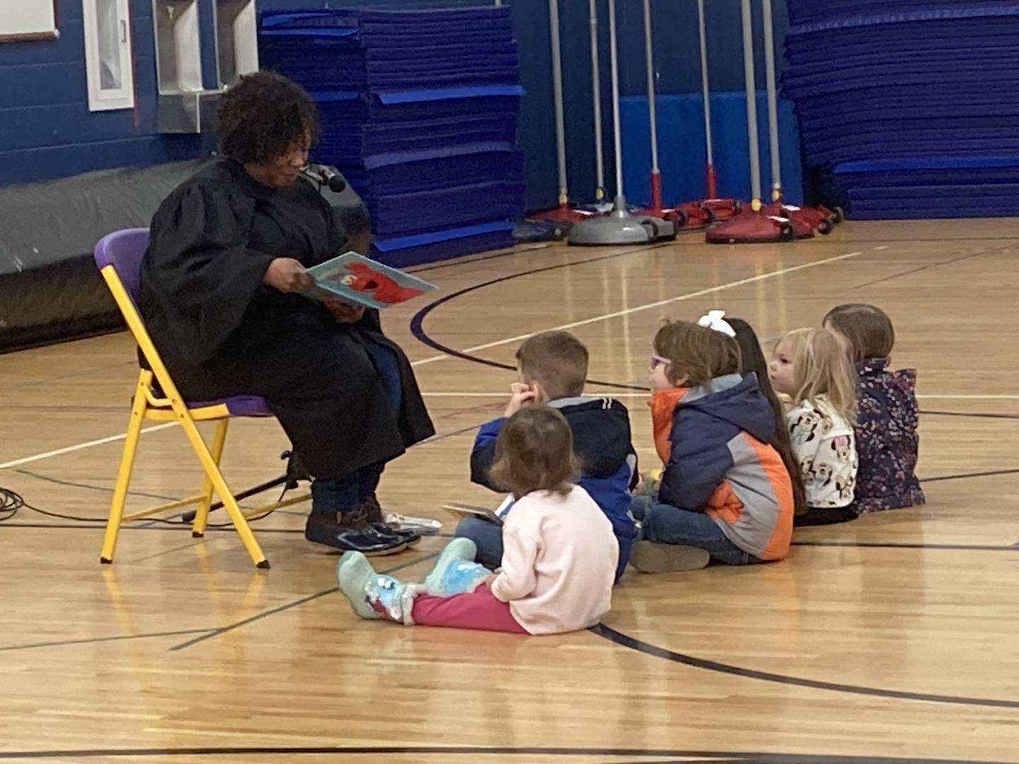 Will County Judge Colette Safford reads to children at the Will County Children's Fair at Troy Middle School in Plainfield on Monday, Feb. 17, 2025.