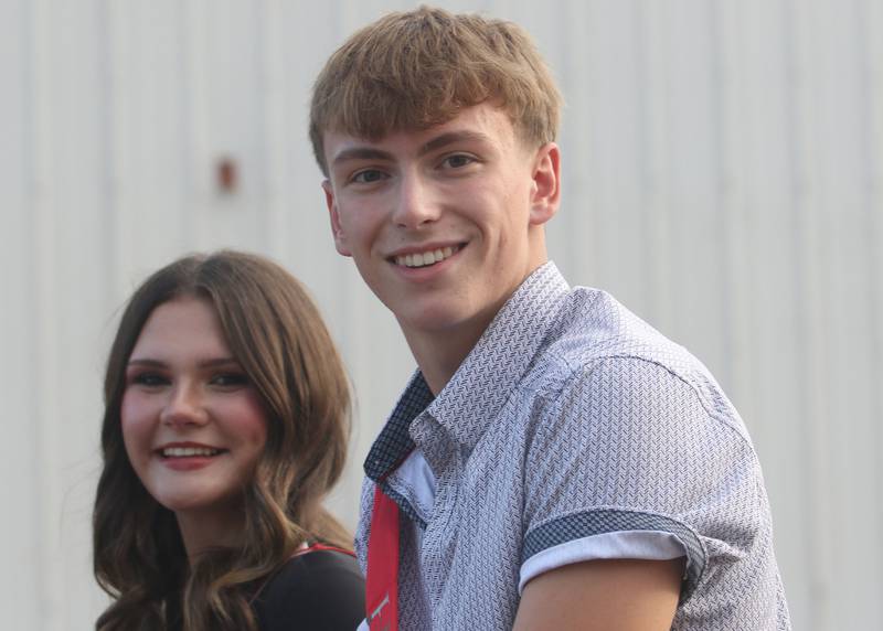 Hall homecoming king candidate Landan Roel and queen candidate Ella Sorlain ride during the Homecoming parade on Thursday, Sept. 18, 2025 downtown Spring Valley.