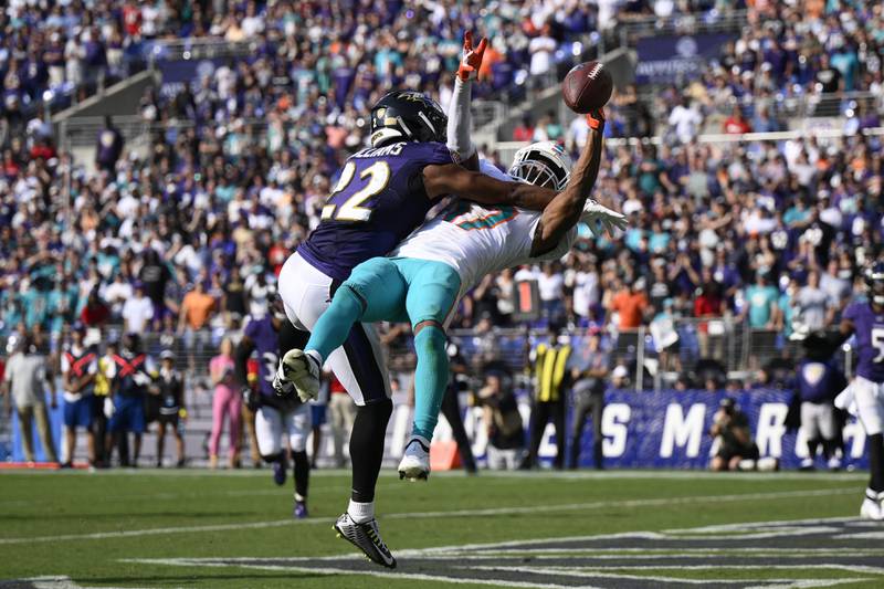 Baltimore Ravens cornerback Damarion Williams (22) breaks up a pass intended for Miami Dolphins wide receiver Jaylen Waddle (17) during the second half of an NFL football game, Sunday, Sept. 18, 2022, in Baltimore. (AP Photo/Nick Wass)