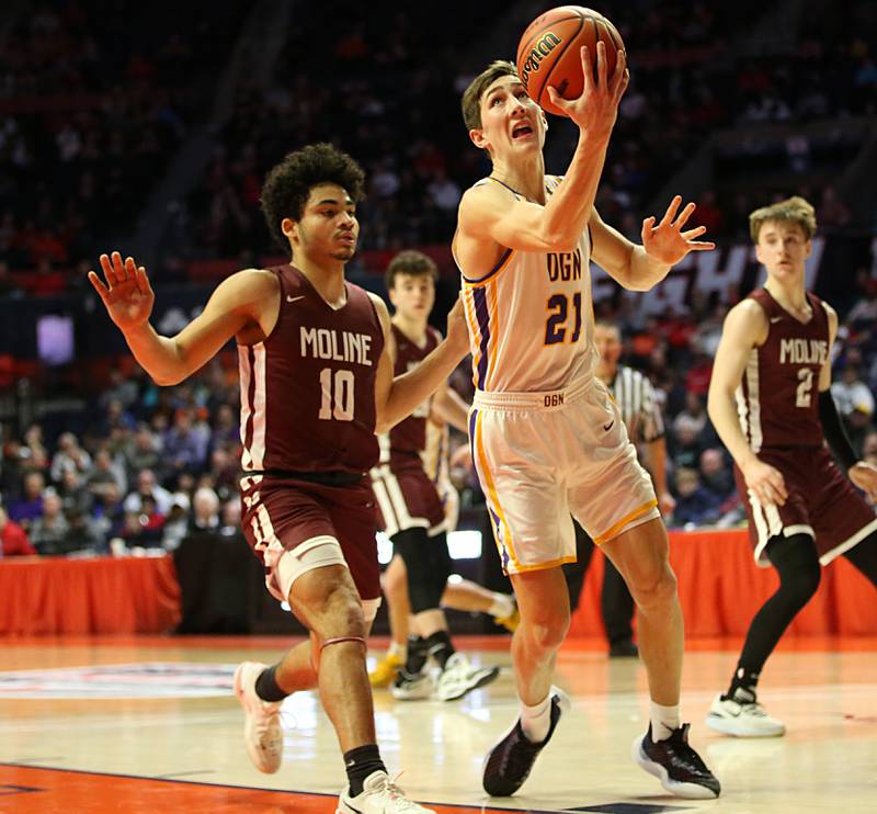 Downers Grove North's Jack Stanton runs in the lane to score over Moline's Jasper Ogburn during the Class 4A state semifinal game on Friday, March 10, 2023 in Champaign.
