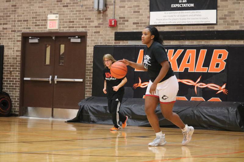 A'Jah Davis (right) takes to the court Monday, Dec. 5, 2022 in the Toys for Tots community basketball game.