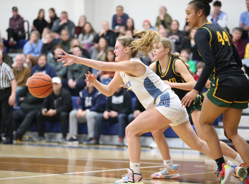 Nazareth's Gracie Carstensen (22) tries to squeeze past the defense during the girls varsity basketball game between Fremd and Nazareth on Monday, Jan. 9, 2023 in La Grange Park, IL.