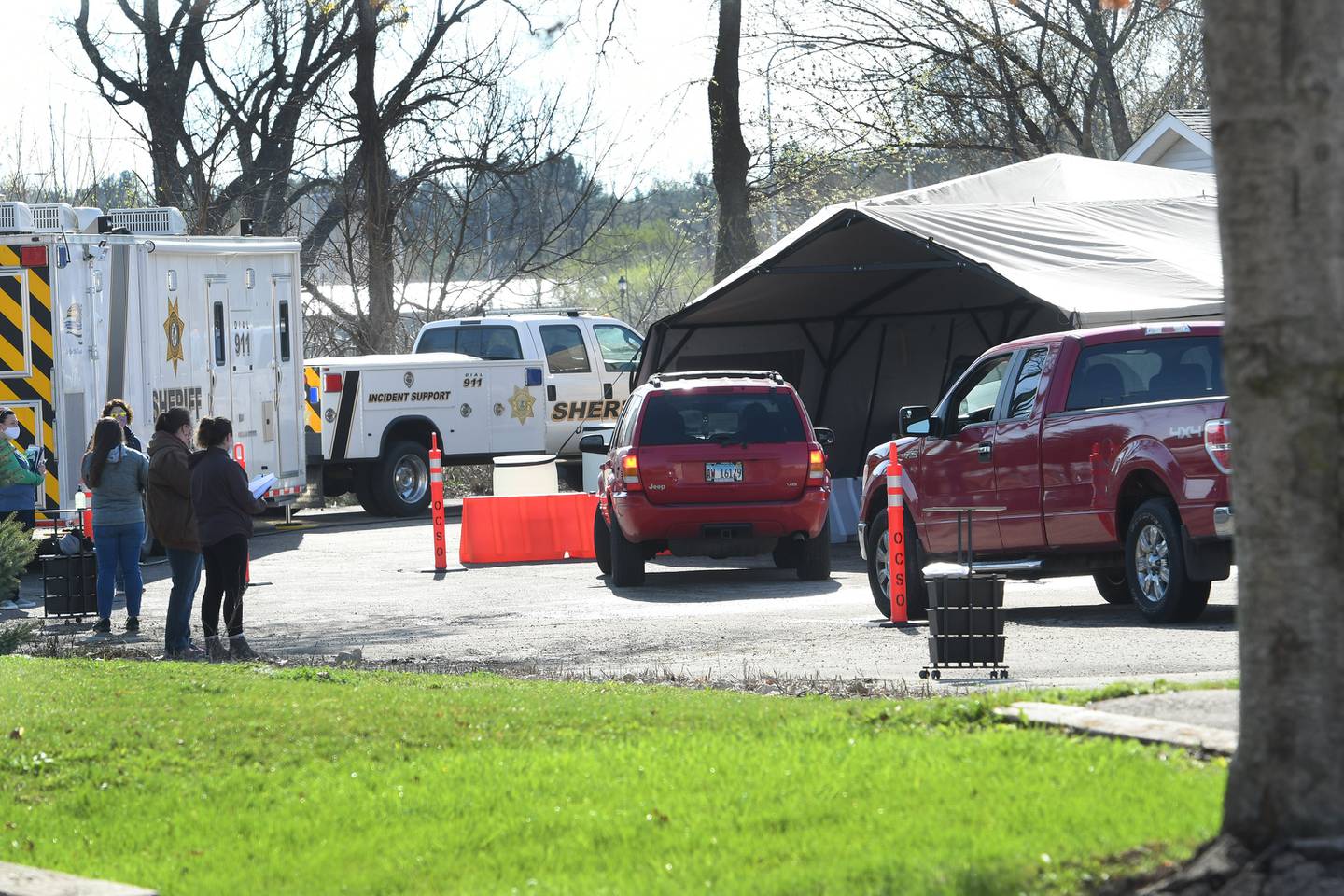 Ogle County residents drive up to the Ogle County Health Department's mass vaccination drive-thru event on Monday morning in Oregon. The event was held in the Oregon Fire Department's parking lot. County residents had to pre-register for the vaccine.