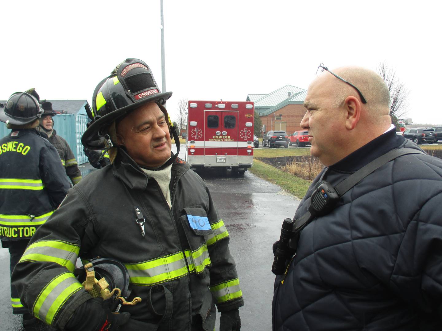 Kendall County Board member Ruben Rodriguez, left, speaks with Oswego Fire Protection District Chief John Cornish during a fire operations training session at the district's Station 3 in Montgomery on March 19, 2022. (Mark Foster -- mfoster@shawmedia.com)