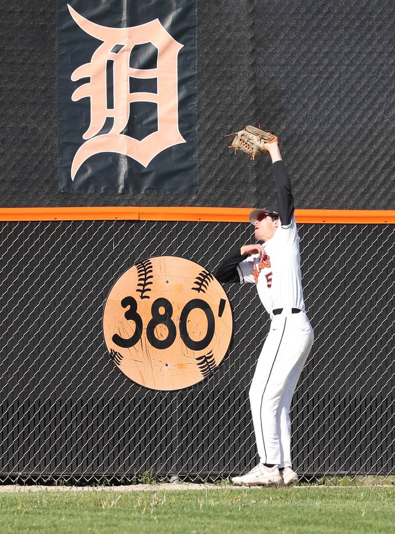 DeKalb's Cole Latimer makes a catch right in front of the 380 sign during their game against Neuqua Valley Tuesday, May 7, 2024, at DeKalb High School.