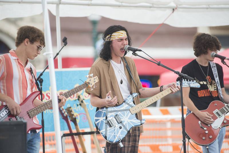 Members of the band SOMA play a Led Zeppelin cover Saturday, June 11, 2022 in downtown Dixon for the ninth annual Rosbrook Studio street fest.