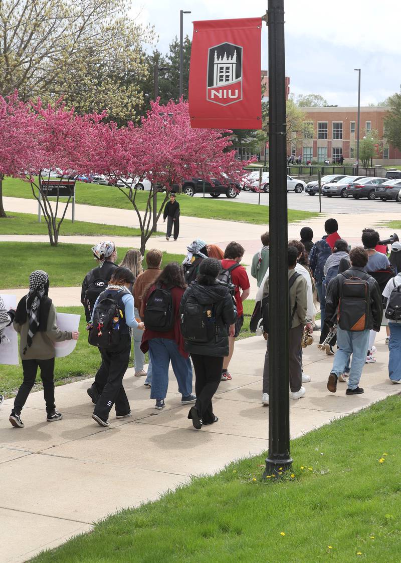 A group of about twenty demonstrators march on campus at Northern Illinois University in DeKalb Monday, April 29, 2024, to protest the Israel-Hamas War.