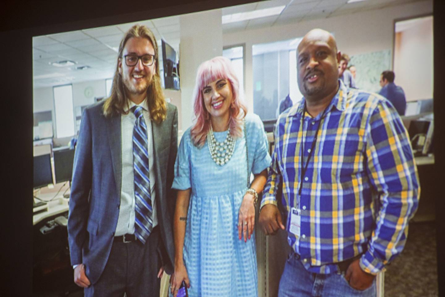 2012 Oregon graduate Eli Murray (left) is seen with Tampa Bay Times colleagues Rebecca Woolington and Corey G. Johnson after having been chosen for the Pulitzer Prize for investigative journalism.