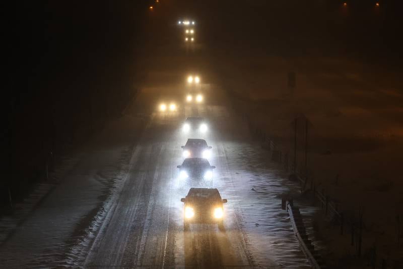 Traffic moves along slowly on east bound I-80 early Wednesday morning. Wednesday, Feb. 2, 2022, in Joliet.