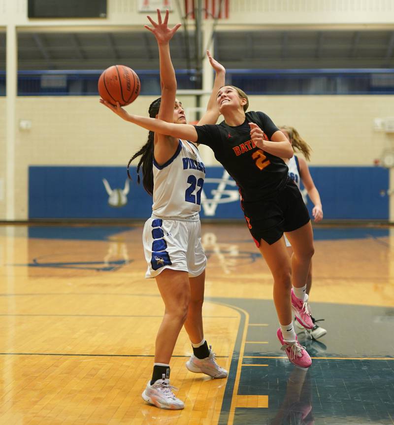 Batavia's Brooke Carlson (2) shoots the ball in the post against Geneva’s Leah Palmer (22) during a basketball game at Geneva High School on Friday, Dec 15, 2023.