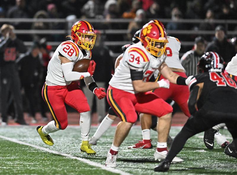 Batavia's Nathan Whitwell (28) runs the ball during the Class 7A semifinal playoff game against Lincoln-Way Central on Saturday, Nov 23, 2024 at New Lenox. (Dean Reid for Shaw Local News)
