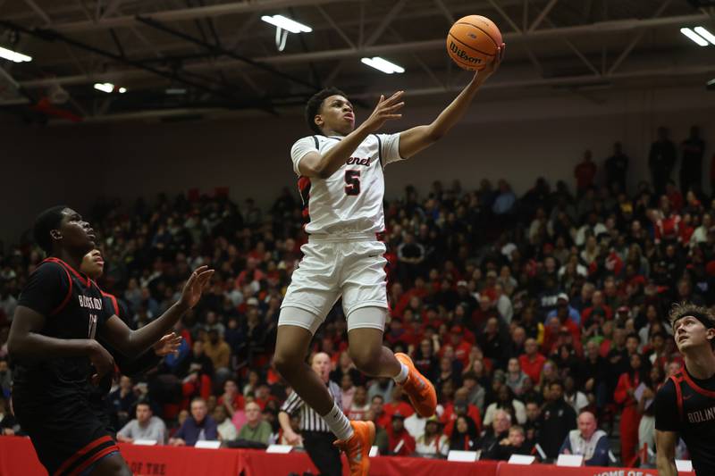 Benet’s Perry Tchiegne lays in a shot against Bolingbrook in the Class 4A Bolingbrook Sectional championship game on Friday, March 6, 2026 in Bolingbrook.
