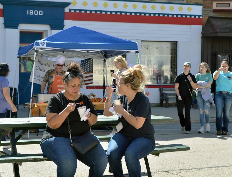 Tracy Perea, of Sterling, (left) and Karen Cox, of Dixon, eat cups of chili on Saturday, Sept. 28, 2024, during the Polo Chili Cook-Off and Block Party in downtown Polo.
