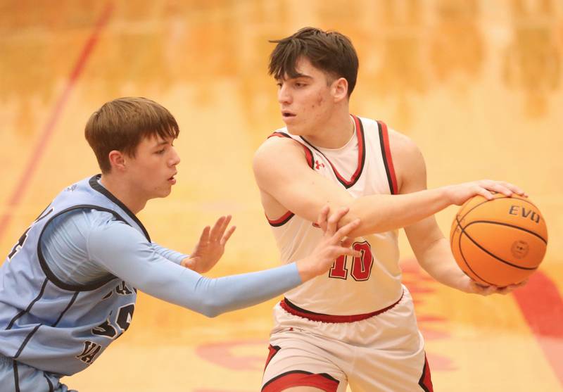 Hall's Jack Curran looks to pass over Bureau Valley's Carson Gruber on Wednesday, Jan. 28, 2026 at Hall High School.