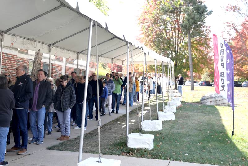 Voters wait in line on Tuesday, Oct. 15, 2024 at the Kane County Clerk’s office to vote early in the 2024 General Election.