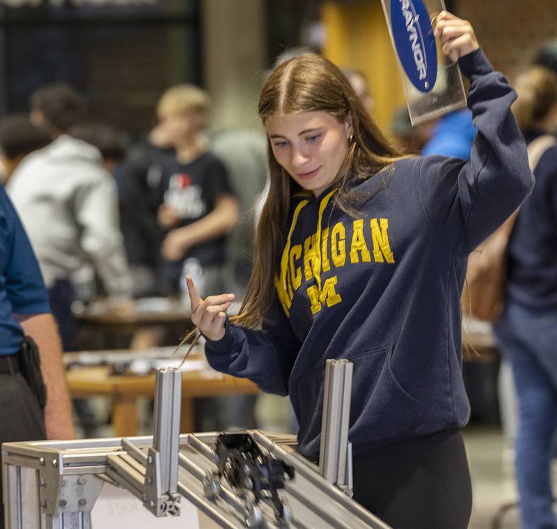 Dixon’s Olivia Arduini releases the gate to start her team’s car down the track Friday, April 26, 2024 during SVCC’s Manufacturing Day.