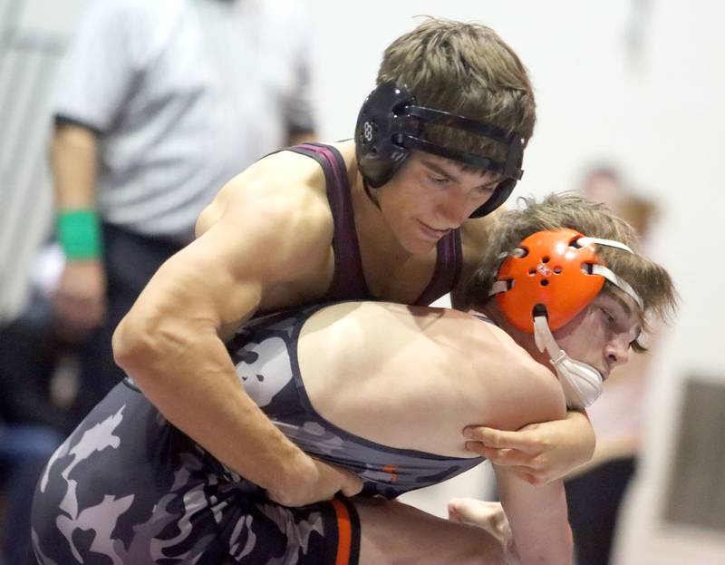 McHenry’s Ryan Johnston, front, battles Prairie Ridge’s Andrew Cioper at 150 pounds in varsity boys wrestling on Thursday, Jan. 8, 2026 at Prairie Ridge High School in Crystal Lake.