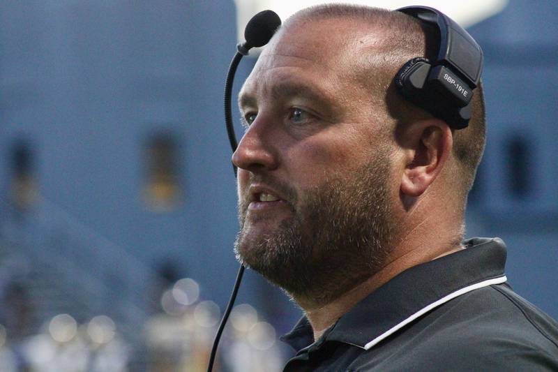Dixon coach Jared Shaner patrols the sidelines on Friday during the team's home opener.