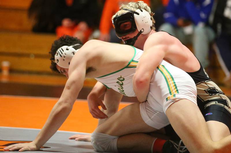 Sycamore's Cooper Bode wrestles Kye Weinzierf in the 175 weight class during the Class 2A Sectional championship on Saturday, Feb. 15, 2025 at Washington High School.