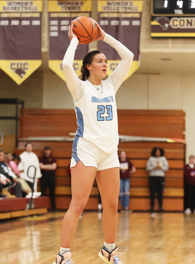 Nazareth's Danielle Scully (23) looks for an outlet during the girls 3A varsity super-sectional game between Nazareth Academy and Fenwick High School in River Forest on Monday, Feb. 27, 2023.