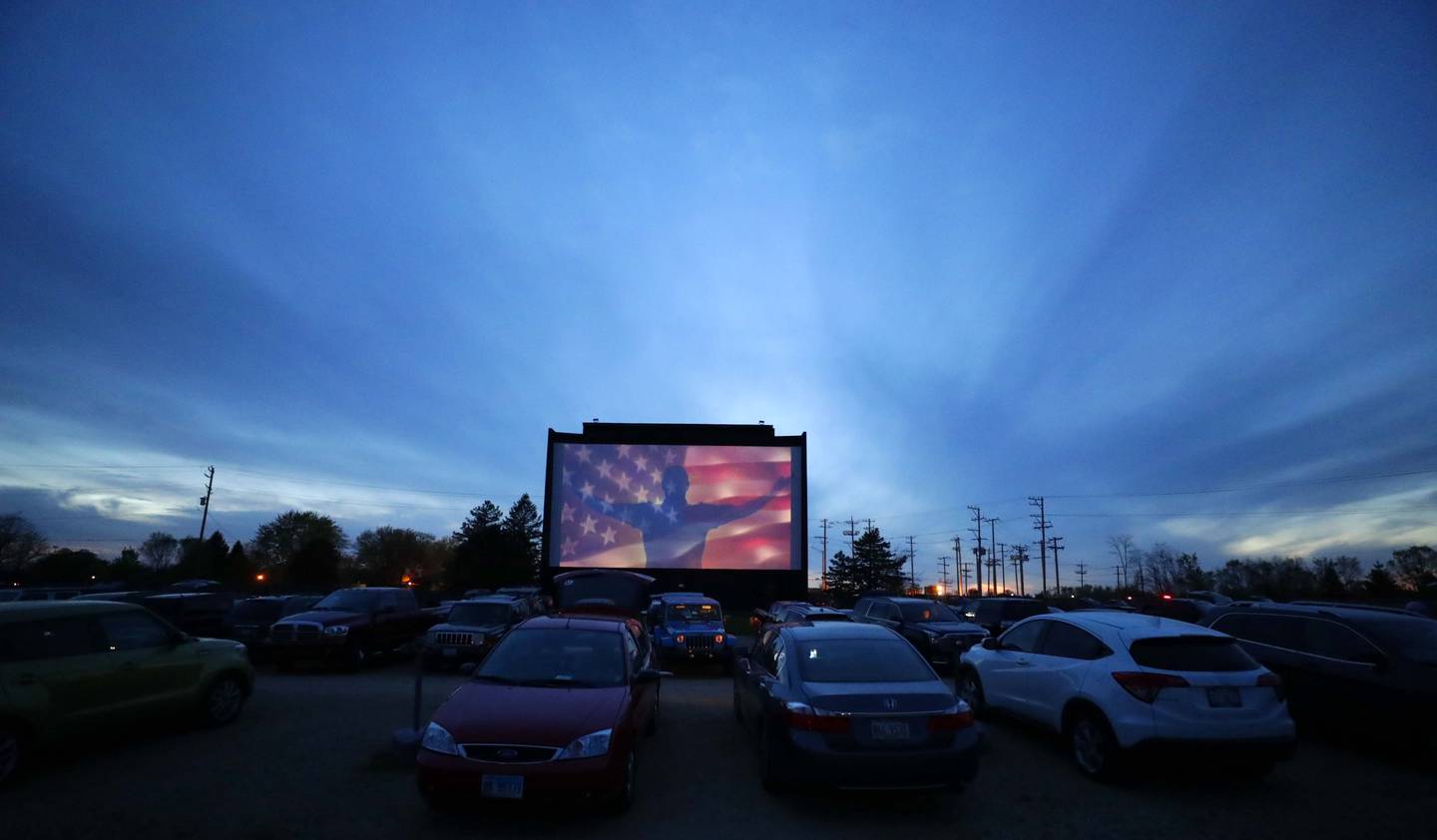 The national anthem plays as the McHenry Outdoor Theater reopened Friday April 30, 2021, in McHenry.