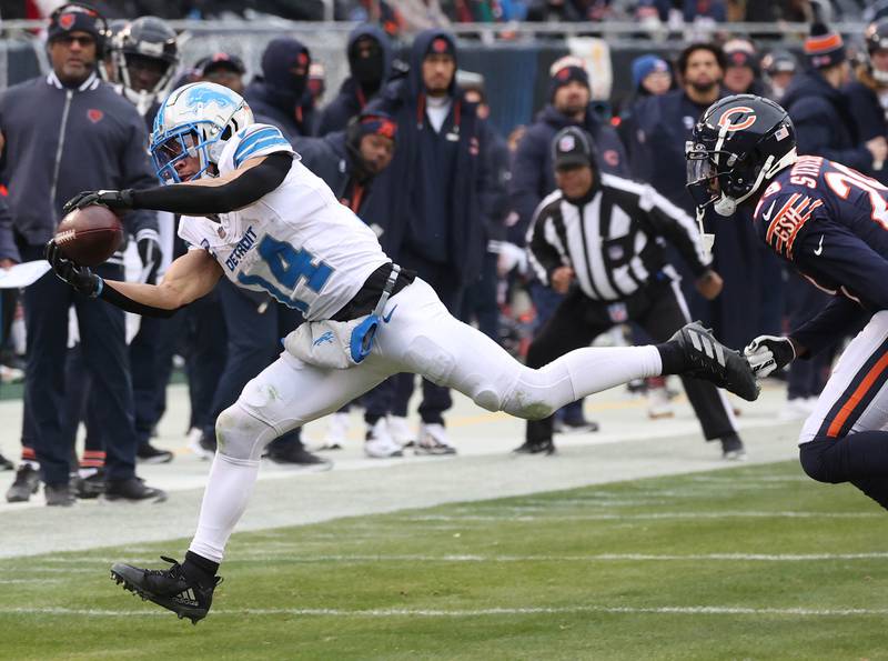 Detroit Lions wide receiver Amon-Ra St. Brown makes a catch in front of Chicago Bears cornerback Tyrique Stevenson during their game Sunday, Dec. 22, 2024, at Soldier Field in Chicago.