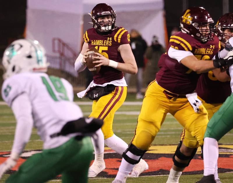 Loyola Academy's Ryan Fitzgerald looks for a receiver during their Class 8A state championship game against York Saturday, Nov. 30, 2024, in Hancock Stadium at Illinois State University in Normal.