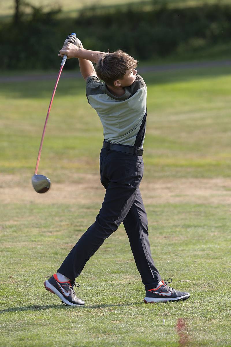 Liam Rosquist, 12, tees off Wednesday, Sept. 10, 2025, during his junior league golf session at Timber Creek in Dixon.