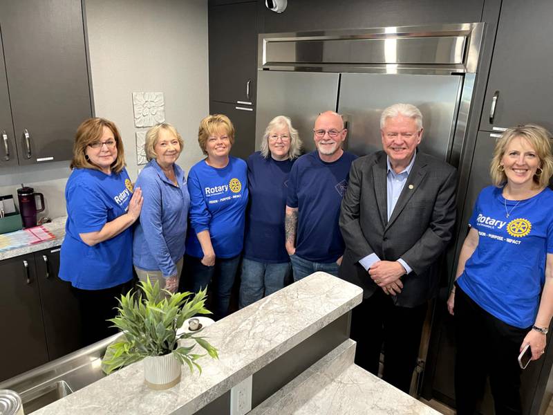 Rotarians take a photo in front of the recently purchased double refrigerator.  (from left) Cathy Foes (community service chair), Pat Schou (vice president), Bonnie Anders, Dana & Jeff VanAutreve (founders of Second Story), Steve Bouslog (president-elect),and Tracy Grimmer (assistant governor).