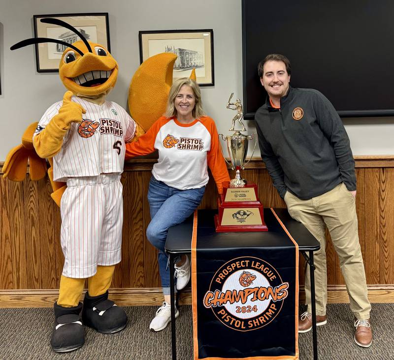 SouthClaw Sam, General Manager June Keeley and Assistant General Manager Lucas Burris pose with the 2024 Prospect League Championship trophy during Peru’s Monday night council meeting.