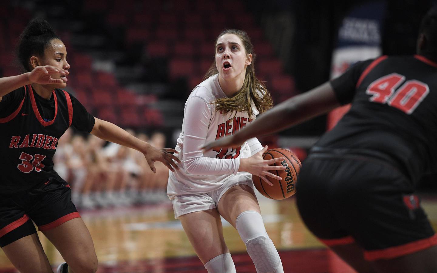 Benet Academy’s Maggie Sularski looks for the hoop as Bolingbrook's Angelina Smith and Jasmine Jones, right, defend in the Class 4A state 3rd place game at Redbird Arena at Illinois State University in Normal on Friday, March 4, 2022.