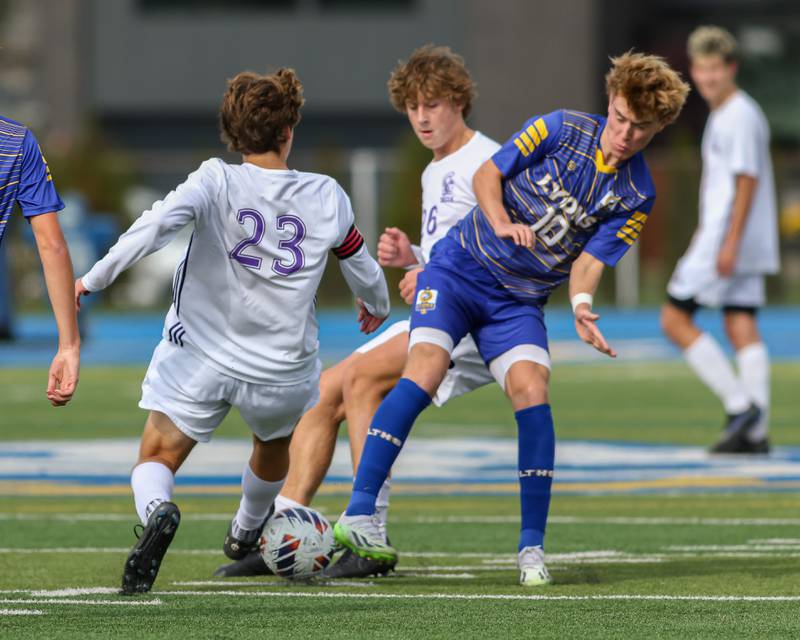 Downers Grove North's Ryan Wilson (23) and Lyons Haris Sarajlija (10) battle for possession during Class 3A Lyons Regional final soccer match.  Oct 21, 2023.