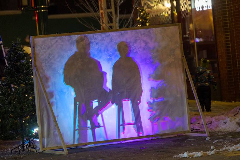 Silhouettes are seen at a Photo Booth set up Friday, Dec. 5, 2025, by Hope Bible Fellowship Church at Dixon’s Christmas Walk.