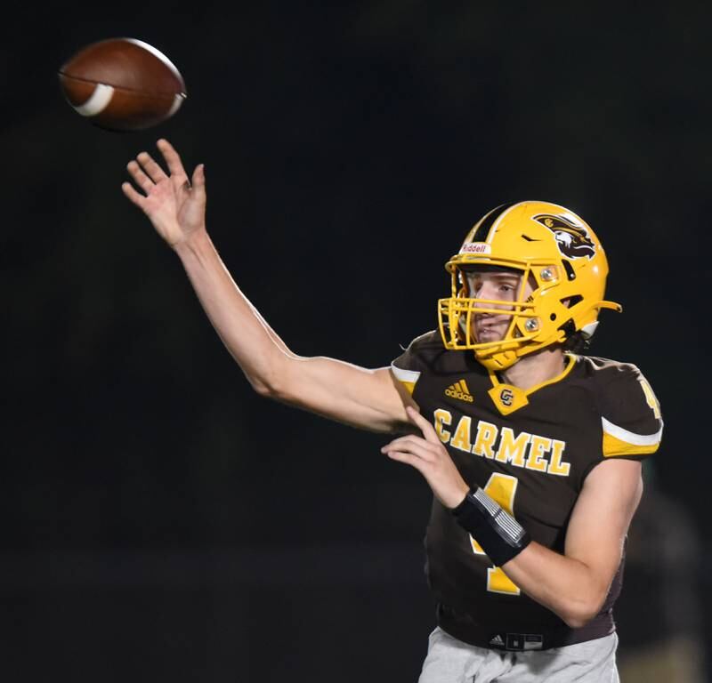 Joe Lewnard/jlewnard@dailyherald.com
Carmel quarterback Johnny Webber throws a pass during Friday’s game agianst St. Viator.