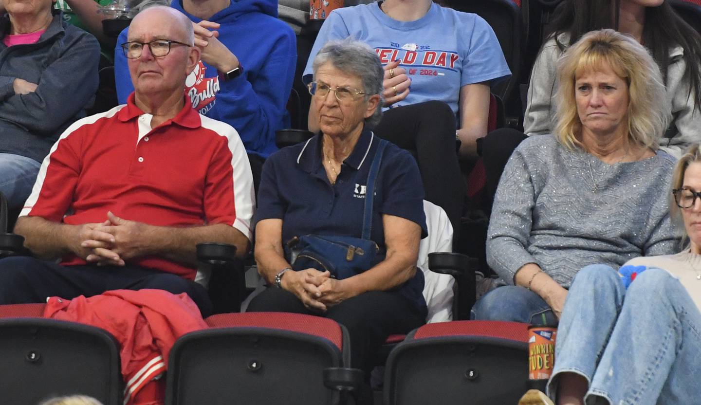 Robin Keane's parents Bob and Crete LeFevre of Mt. Morris watch as their daughter Robin Keane officiates the Columbia vs. Rockford Christian 2A semifinal match at the state volleyball tournament at Illinois State University on Friday, Nov. 14, 2025. Sitting with the LeFevres is Trish Patterson of Polo who is also a volleyball official.