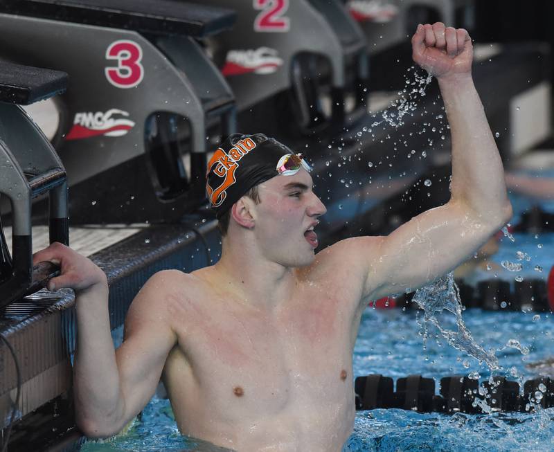 DeKalb’s Jacob Gramer celebrates his firrst-place finish in the 100-yard butterfly during the boys state swimming and diving finals at FMC Natatorium on Saturday, Feb. 24, 2024 in Westmont.