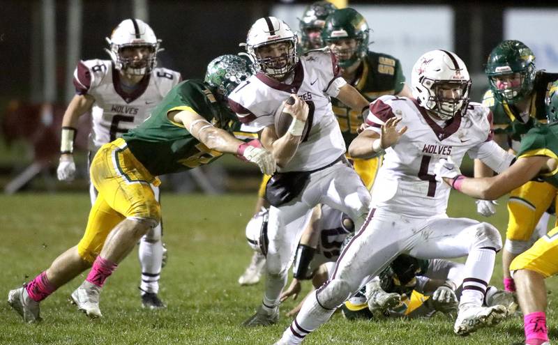 Prairie Ridge’s Tyler Vasey navigates through heavy traffic  in varsity football action at Ken Bruhn Field on the campus of Crystal Lake South Friday evening.