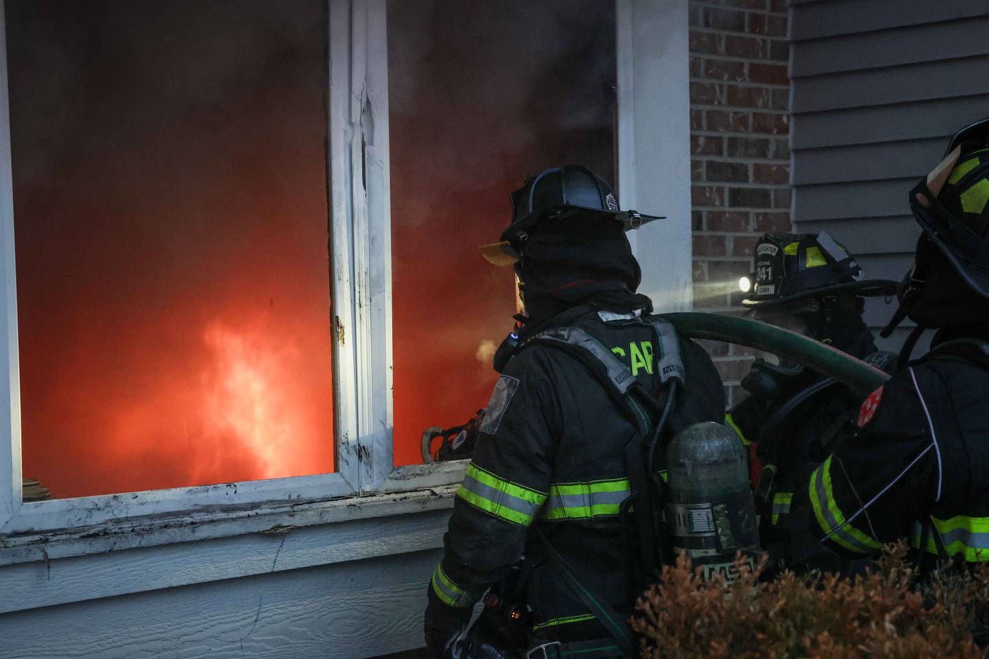 Crews battle a large fire that engulfed a Cary home on Dec. 31, 2025. A dog was missing after the blaze.
