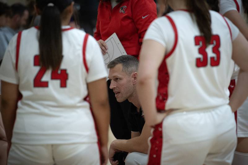 Bradley-Bourbonnais's head girls coach Kevin Maciejewski, center, talks with his team in the Beecher Fall Classic on Tuesday, November 18, 2025.