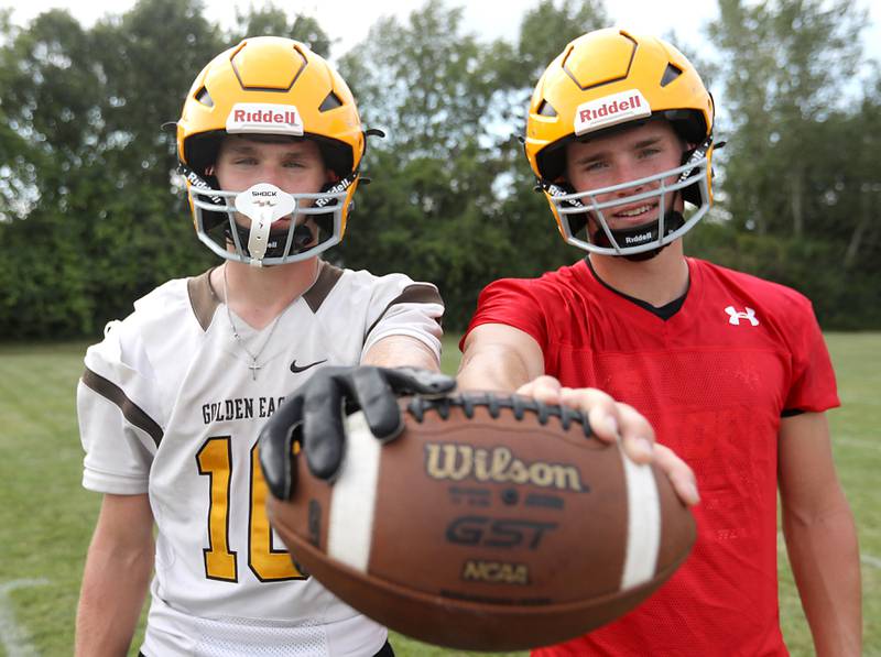 Twins Carson (left) and Connor Goehring during football practice on Tuesday, August 15, 2025, at Jacobs High School in Algonquin. Carson plays wide receiver and Connor plays quarterback.