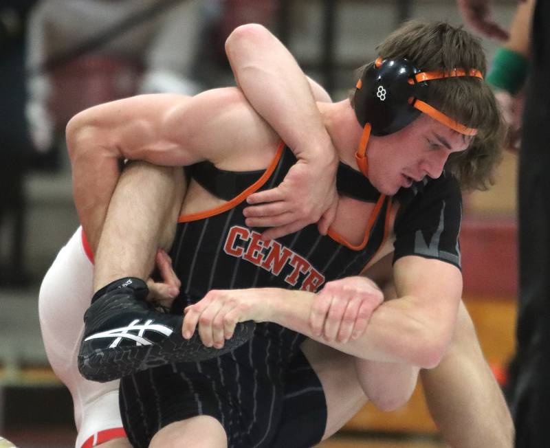 Huntley’s Lucas Bittman, back, battles Crystal Lake Central’s Tommy Tommasello at 165 pounds in varsity wrestling on Friday, Dec. 13, 2024 at Huntley High School in Huntley.