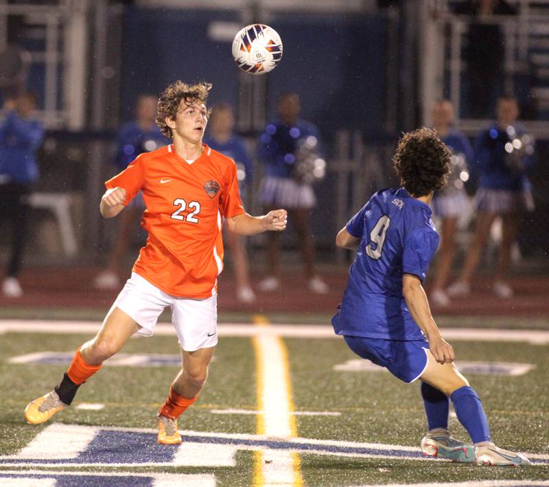 St. Charles East’s Garrett Melton heads the ball during a Tri-Cities Night game against St. Charles North at St. Charles North on Thursday, Sept. 21, 2023.