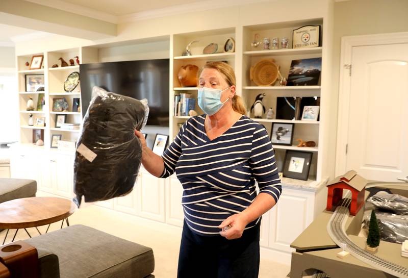 Tassie Brautigam and other volunteers gathered in the basement of her St. Charles home to sort children’s winter coats to be donated to the Salvation Army, Lazarus House and area schools.