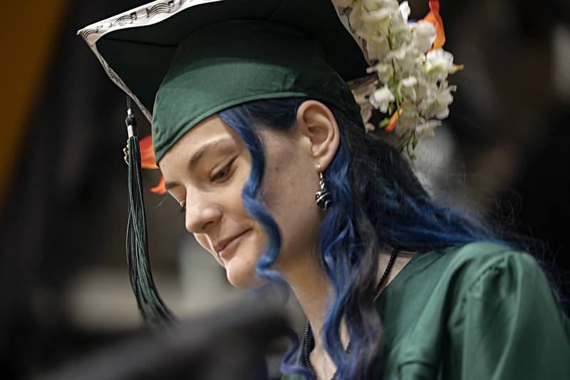 Savanna Wood-Kendrick shows off an ornate hat Sunday, May 28, 2023 at Rock Falls High School’s 144th commencement ceremony.