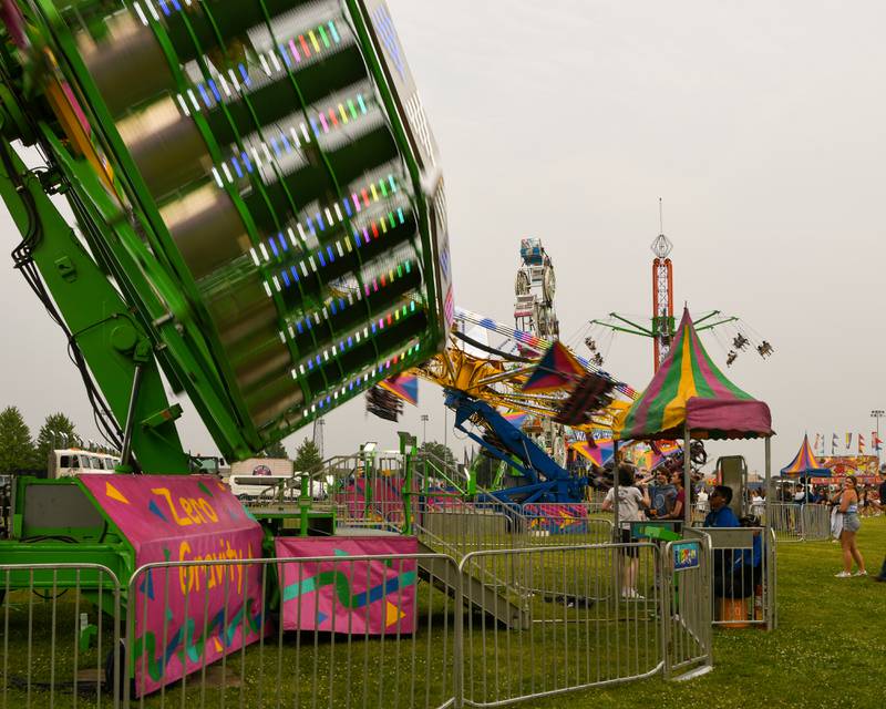 Community members enjoy the fire ball ride on Thursday June 12, 2025, during PrairieFest held at PrairieFest Park in Oswego.