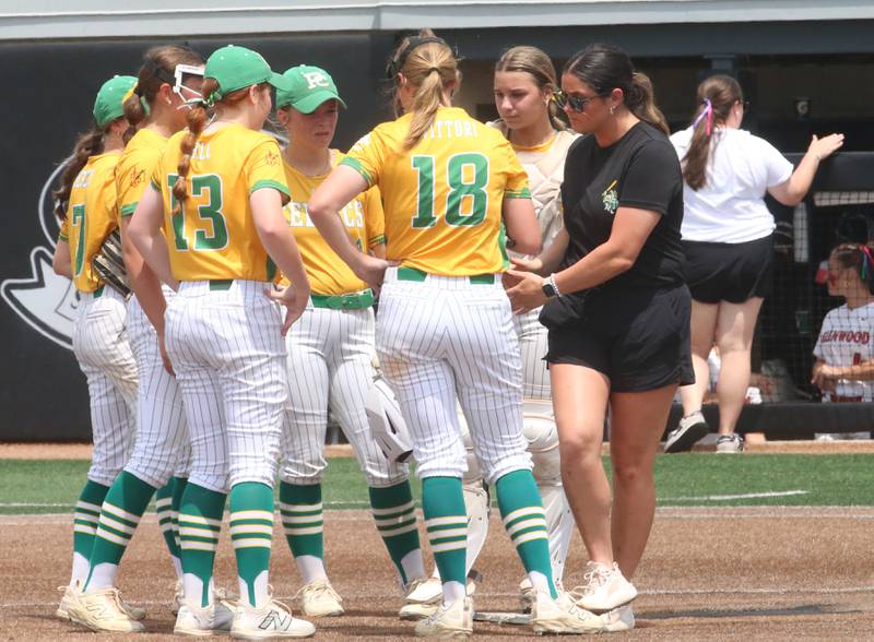 Members of the Providence Catholic softball team meet on the mound while playing Chatham during the Class 3A State finals game on Saturday, June 14, 2025 at the Louisville Slugger Sports Complex in Peoria.