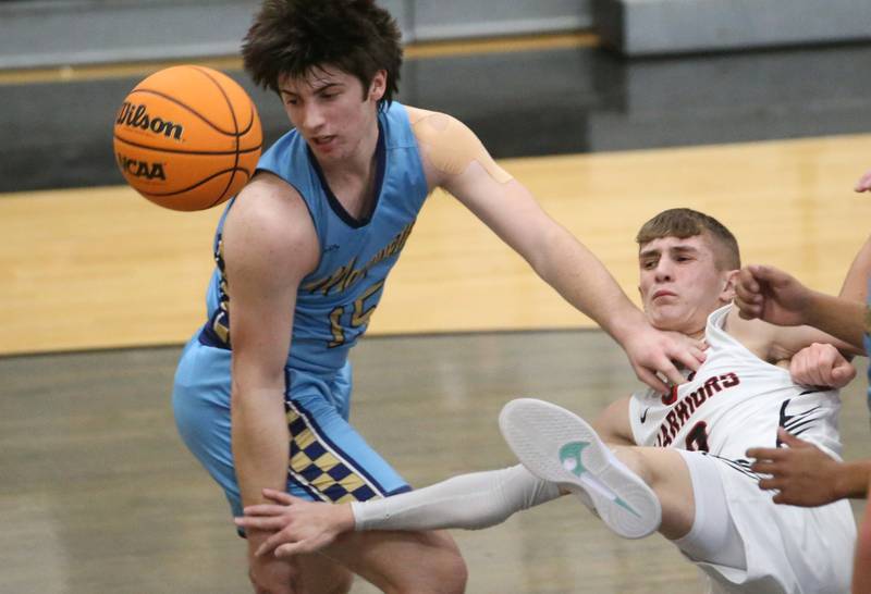 Marquette's Alec Novotney and Woodland's Noah Decker fail to grab a rebound as the ball sailed out of bounce during the Tri-County Conference Tournament on Tuesday, Jan. 28. 2025 at Putnam County High School.
