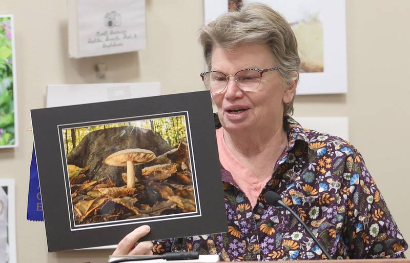 Nancy Brejc of Earlville, holds her first place photo of a mushroom taken at Shabbona Lake State Park during the Starved Rock Photography Show awards on Saturday, Jan. 3, 2026 at the Starved Rock Visitors Center.
