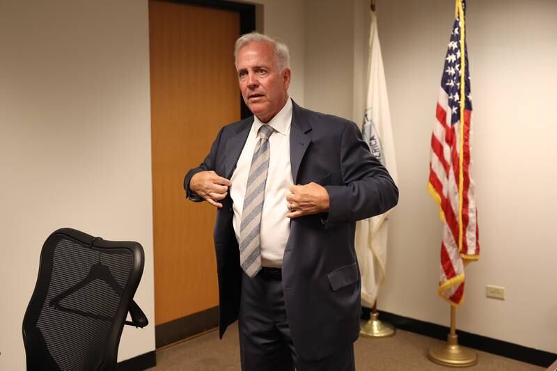 Mayor Terry D’Arcy puts on his jacket while talking to his secretary about his next meeting at City Hall on Friday, Aug. 11, 2023 in Joliet.